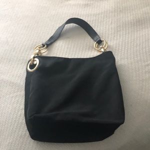 Bucket shoulder bag with clunky gold hardware